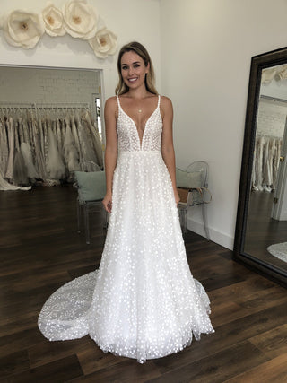 Chic champagne bridal dress with intricate lace applique, sweetheart neckline, off-the-shoulder straps, and a dramatic mermaid fit, tailored for elegant and modern weddings