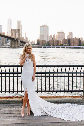 Chic ivory mermaid gown with floral lace detailing, strapless sweetheart neckline, dramatic backless design, and a fit-and-flare silhouette, tailored for timeless and sophisticated weddings