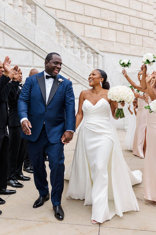 Chic ivory gown with a strapless sweetheart neckline, structured bodice, and luxurious A-line silhouette with a dramatic train, tailored for sophisticated wedding ceremonies