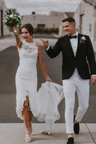 Sophisticated ivory tulle wedding dress with 3D floral lace embroidery, strapless sweetheart neckline, backless mermaid silhouette, designed for elegant and magical wedding occasions