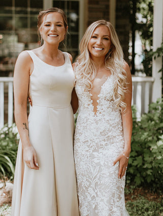 Sophisticated ivory wedding dress with a sweetheart neckline, intricate floral lace, puff sleeves, and an A-line tulle silhouette, ideal for elegant and classic wedding ceremonies