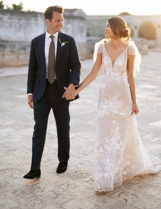 Custom ivory bridal gown with 3D floral applique, deep V-plunge neckline, short cap sleeves, and backless design, A-line tulle silhouette perfect for a fairytale princess wedding