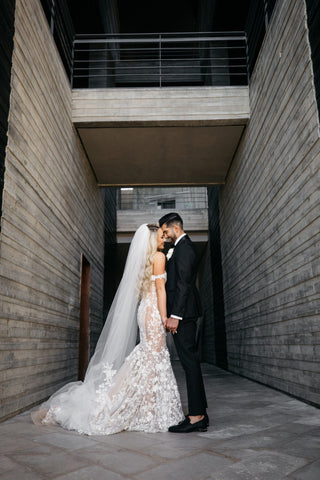 Sophisticated ivory bridal dress with floral applique, sweetheart neckline, delicate thin straps, and a mermaid fit-and-flare design, ideal for an elegant and magical wedding celebration