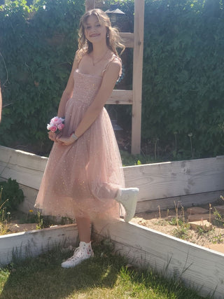 Elegant blush midi dress with delicate sequin detailing, strapless fitted top, and a voluminous tulle skirt, perfect for weddings, proms, or modern evening wear