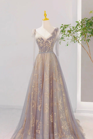 An enchanting gown featuring a soft lilac hue and golden embroidery, exuding timeless elegance