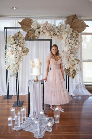 Elegant wedding dress featuring delicate ruffled tulle layers, a strapless sweetheart neckline, and a flowing A-line ball gown design, ideal for fairy-tale-inspired bridal celebrations