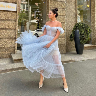 Elegant light blue evening dress featuring tiered tulle layers and a sweetheart neckline, offering a timeless fairytale look