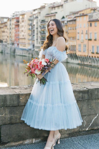 Charming pale blue gown with a fitted bustier-style top and delicate ruffled details, ideal for weddings or special events