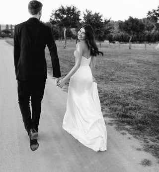 Sophisticated strapless wedding gown with a corset-style top and soft tulle skirt, ideal for modern and traditional brides alike.