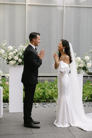 Chic ivory satin bridal gown, strapless design with a figure-flattering mermaid fit and floor-length elegance, tailored for contemporary weddings