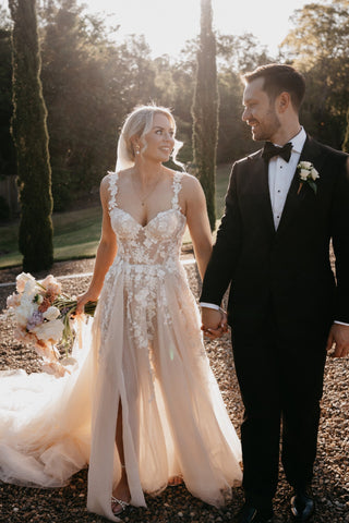 Custom ivory princess ball gown with 3D floral lace applique and embroidery, sweetheart neckline, off-the-shoulder design, and floor-length A-line tulle silhouette, perfect for a romantic bridal look