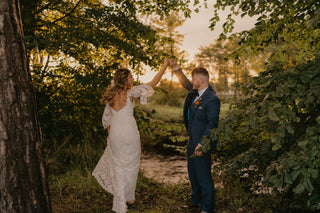 Romantic ivory tulle ball gown adorned with 3D floral lace applique, sweetheart neckline, and puff sheer sleeves, perfect for whimsical and fairy-tale-inspired weddings