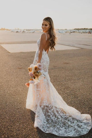 Chic ivory ball gown with floral lace detailing, sweetheart neckline, puff sleeves, and a floor-length tulle A-line silhouette, tailored for timeless and sophisticated weddings