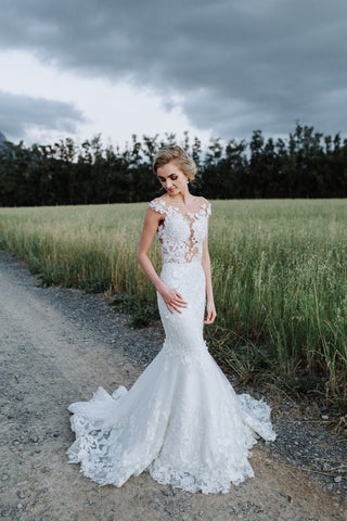 Romantic ivory fit-and-flare bridal gown, adorned with 3D floral lace applique and embroidery, strapless sweetheart neckline with illusion short sleeves, tailored for a glamorous wedding celebration