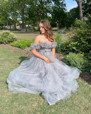 Ivory off-the-shoulder ball gown with 3D floral lace applique, sweetheart neckline, and a floor-length tulle A-line silhouette, perfect for romantic fairy-tale weddings