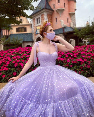 Magical lavender gown with glittering heart embellishments, tie straps, and a full voluminous skirt, ideal for whimsical photo shoots or themed occasions.