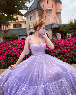 Enchanting lilac princess dress adorned with holographic heart details, featuring a structured bodice and flowing tulle skirt, perfect for fairytale-inspired events