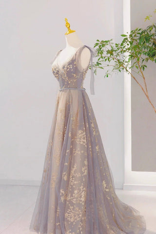 Romantic off-shoulder gown with ethereal embellishments and a subtle shimmer of golden threadwork