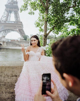 Chic ivory bridal gown with frill layered tulle, off-the-shoulder sweetheart neckline, and a dramatic floor-length A-line silhouette, tailored for sophisticated and classic wedding celebrations