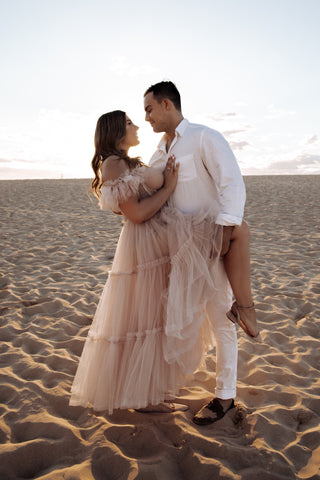 Romantic A-line ball gown adorned with soft ruffled tulle layers, strapless sweetheart neckline, and flowing design, perfect for magical and classic bridal occasions