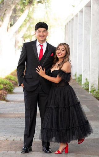 Sophisticated black tulle gown, midi tea-length ball gown with ruffles, a sweetheart neckline, and corset detailing, tailored for gothic prom or party events