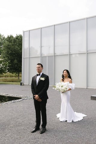 Romantic satin strapless wedding dress in ivory, featuring a mermaid fit and floor-length silhouette, perfect for an elegant and minimalist bridal look