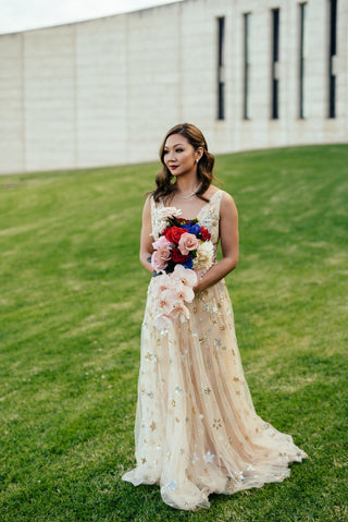 Chic cream celestial ball gown with sparkly starry sequins, deep V-plunge design, and floor-length A-line style, perfect for brides, prom nights, or glamorous evening occasions