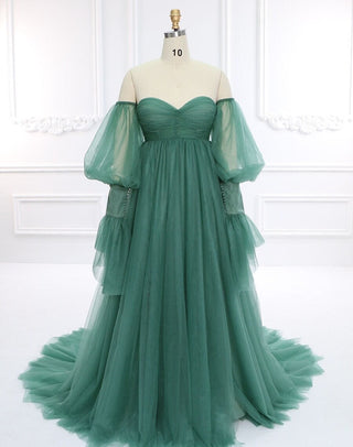 Enchanting green tulle ball gown featuring a sweetheart neckline, dramatic off-the-shoulder puff sleeves, and a flowing floor-length skirt, perfect for formal occasions, proms, or whimsical weddings