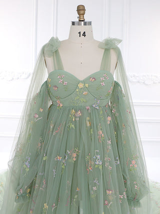 Stunning fairytale-inspired green dress with intricate floral embroidery, a flowing train, and a corset-style bodice, perfect for whimsical weddings or garden parties