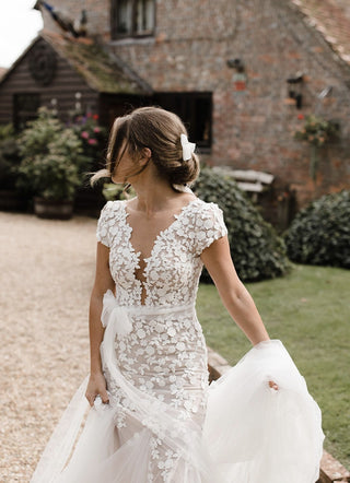 Ivory princess ball gown wedding dress with 3D floral lace applique, sweetheart neckline, off-the-shoulder design, and dramatic tulle A-line silhouette, perfect for romantic and fairy-tale weddings