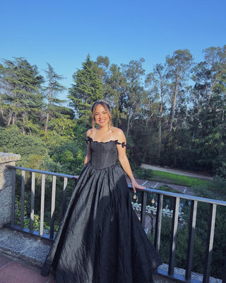 Elegant gothic black satin gown, featuring a scoop neck and crinkle fabric, off-the-shoulder style, ideal for whimsical prom nights and formal occasions