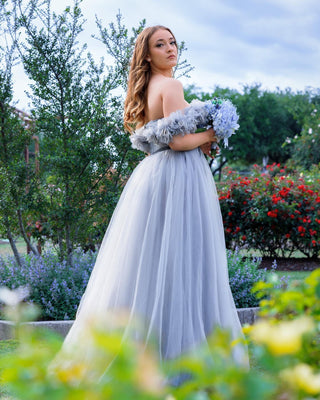 Sophisticated ivory A-line bridal gown with 3D floral embroidery, sweetheart neckline, and an off-the-shoulder tulle silhouette, designed for elegant and magical wedding occasions