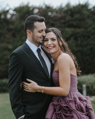 Chic purple A-line dress with intricate ruffled tulle accents and a strapless neckline, tailored for sophisticated and stylish formal events