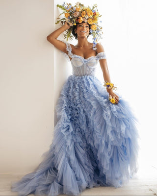 Enchanting powder blue ruffled gown with a structured corset bodice and delicate off-shoulder straps, exuding a whimsical and feminine charm.