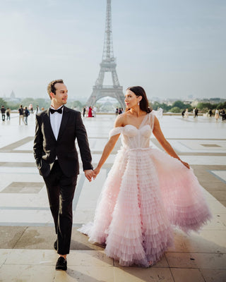 Sophisticated ivory A-line bridal gown with a layered frill tulle skirt, off-the-shoulder design, and sweetheart neckline, designed for elegant and timeless wedding aesthetics